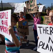 Group of elementary school pupils walking on a protest march